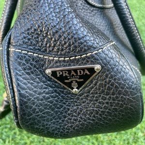 Prada black leather buckle hobo. Silver metallic buckle and detailing.